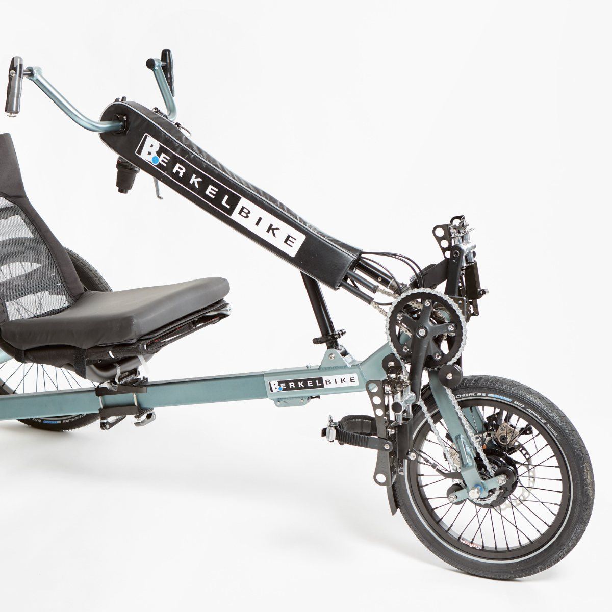 BerkelBike Pro recumbent tricycle with arm cranks, leg pedals, and three wheels.