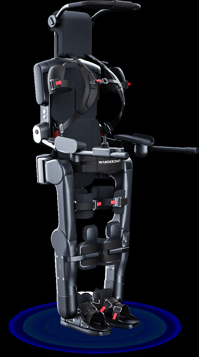 Wandercraft Eve personal exoskeleton: a black self-balancing walking frame with harness straps, armrests, and articulated leg motors, shown empty against a dark background.