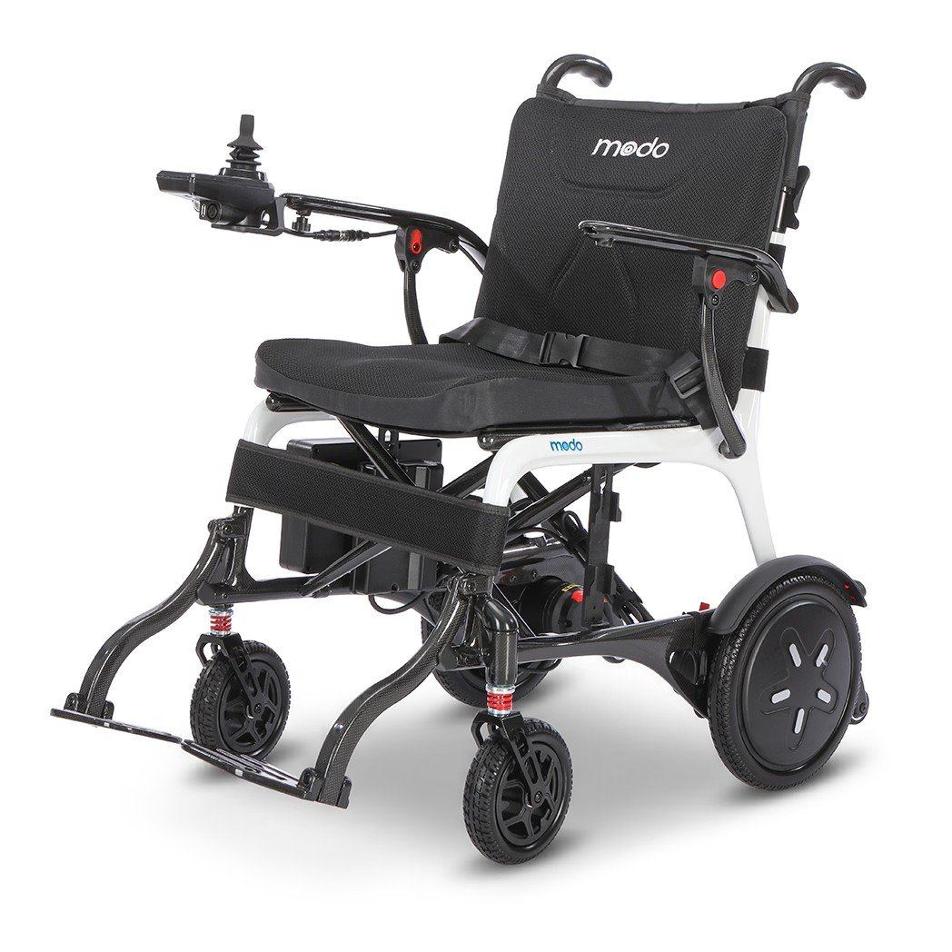 WHILL Modo Breeze ultralight foldable power wheelchair: a white carbon-fiber-accented empty chair with black mesh seat, joystick, and dual drive wheels, shown against a white background.